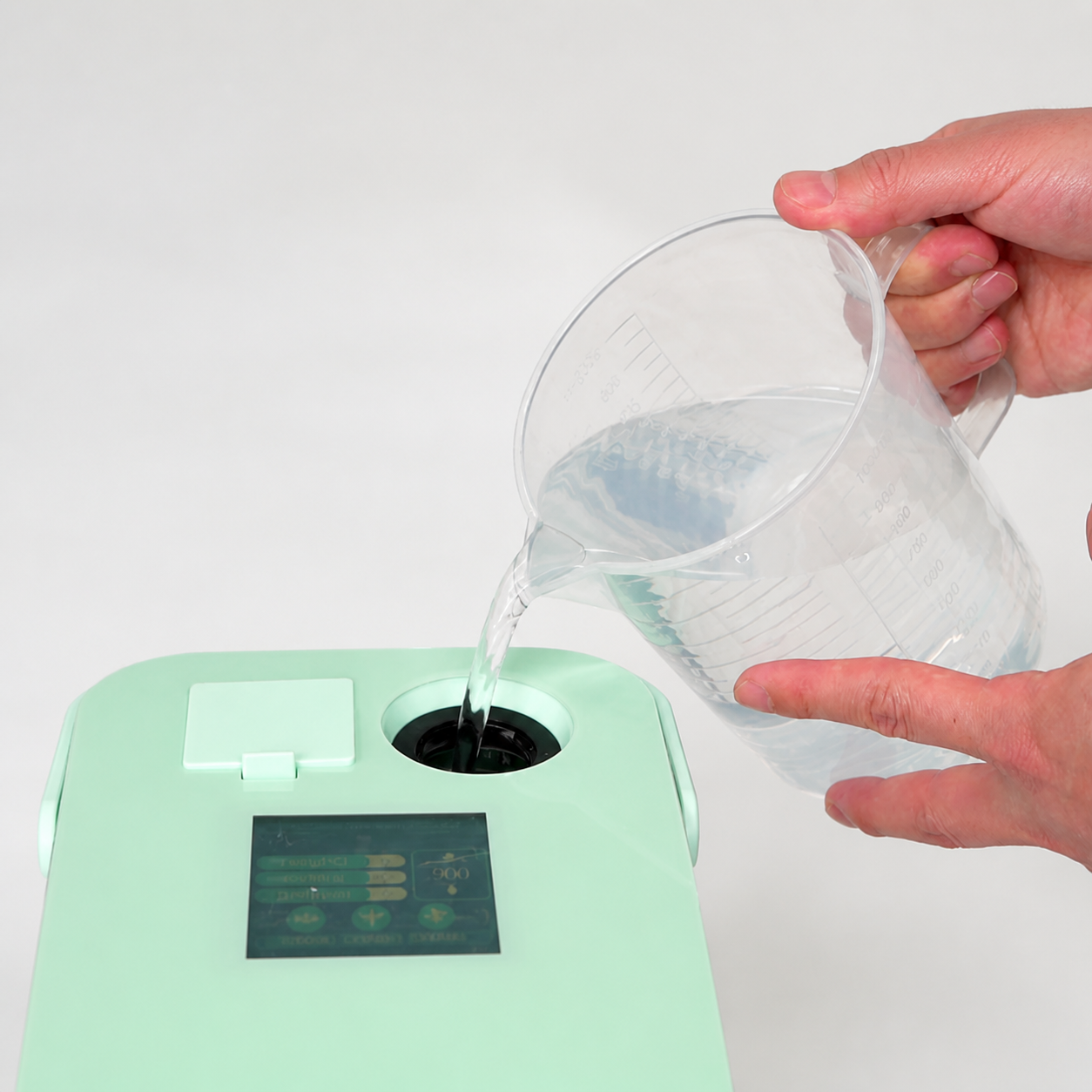 Water being added to the portable hydrogen inhaler fill opening